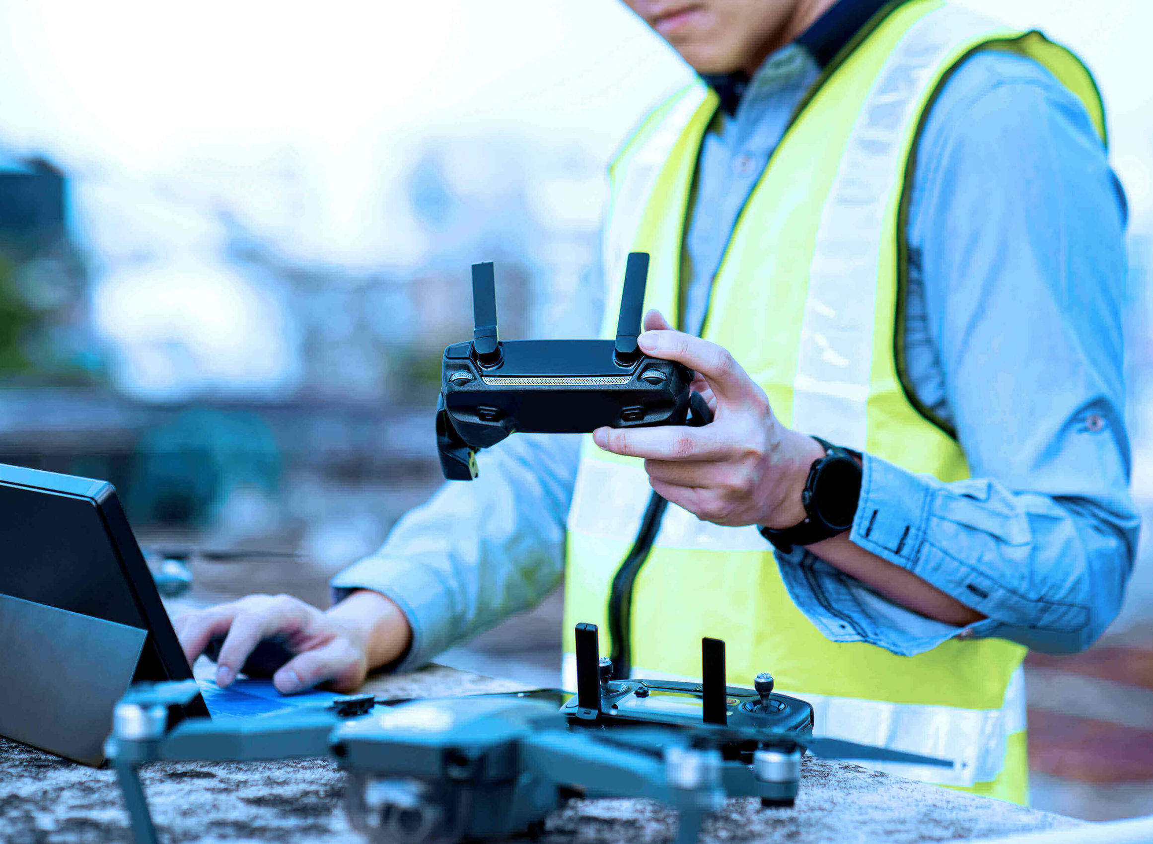 A person holding a drone remote control